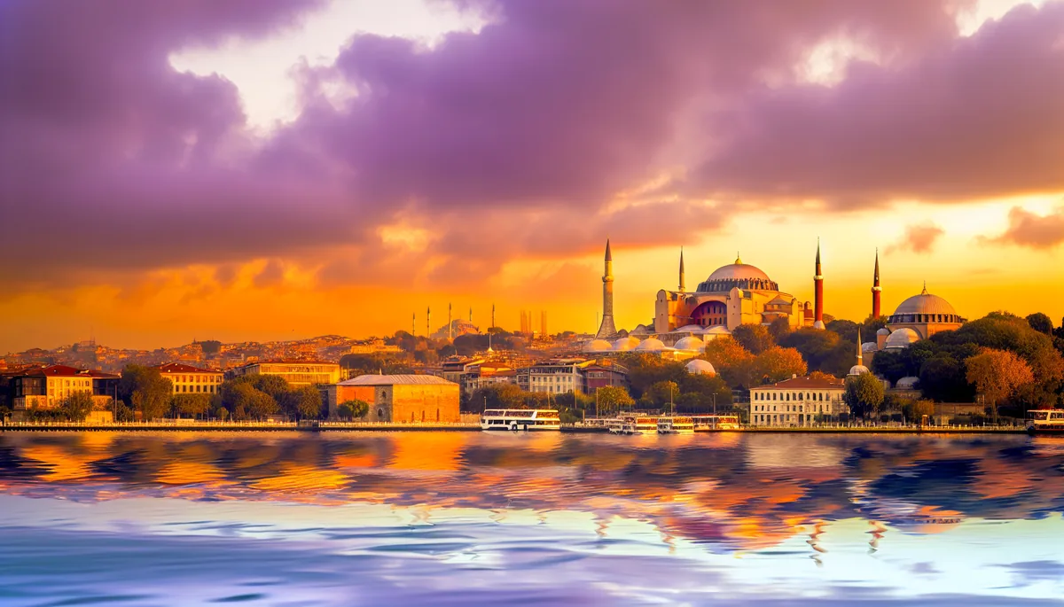 Panoramic view of Istanbul's historic skyline at sunset with iconic mosques and the Bosphorus strait