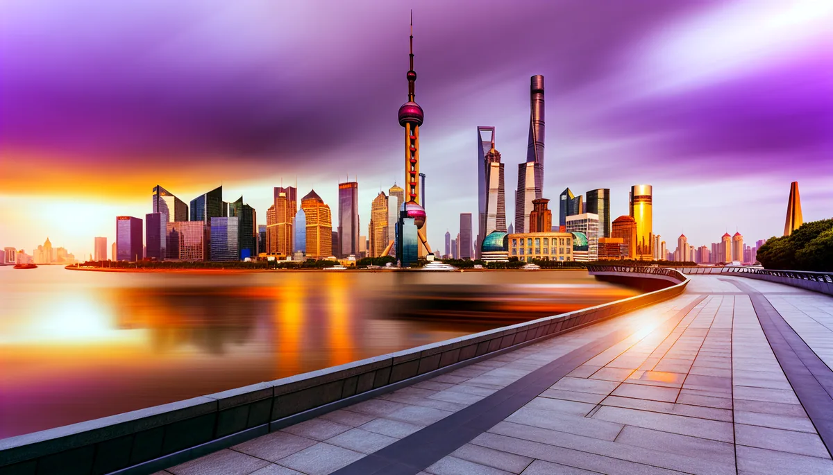 Shanghai skyline at sunset featuring the Oriental Pearl Tower and modern skyscrapers reflecting in the Huangpu River