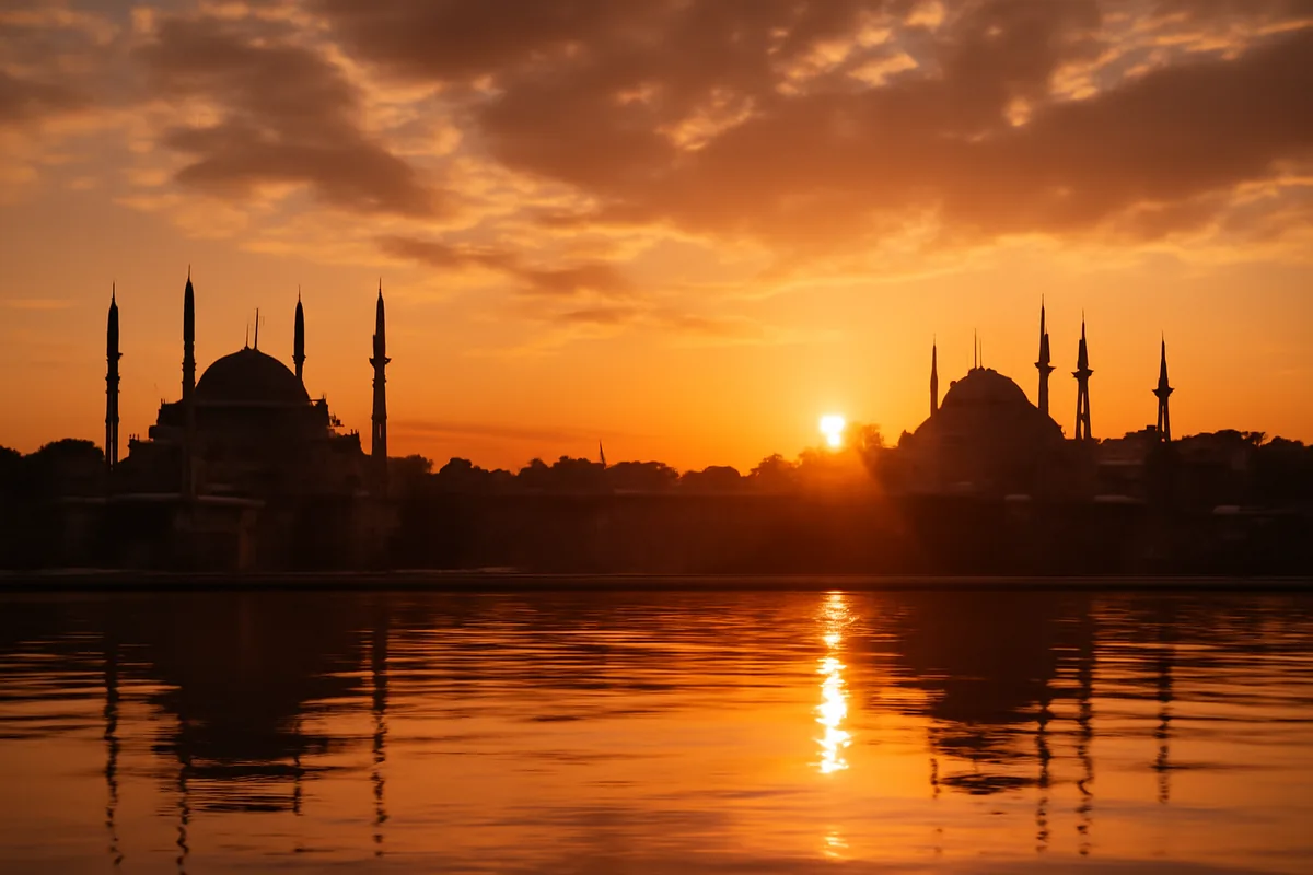 Panoramic golden hour view of Istanbul's skyline with iconic mosque minarets reflected on the Bosphorus strait
