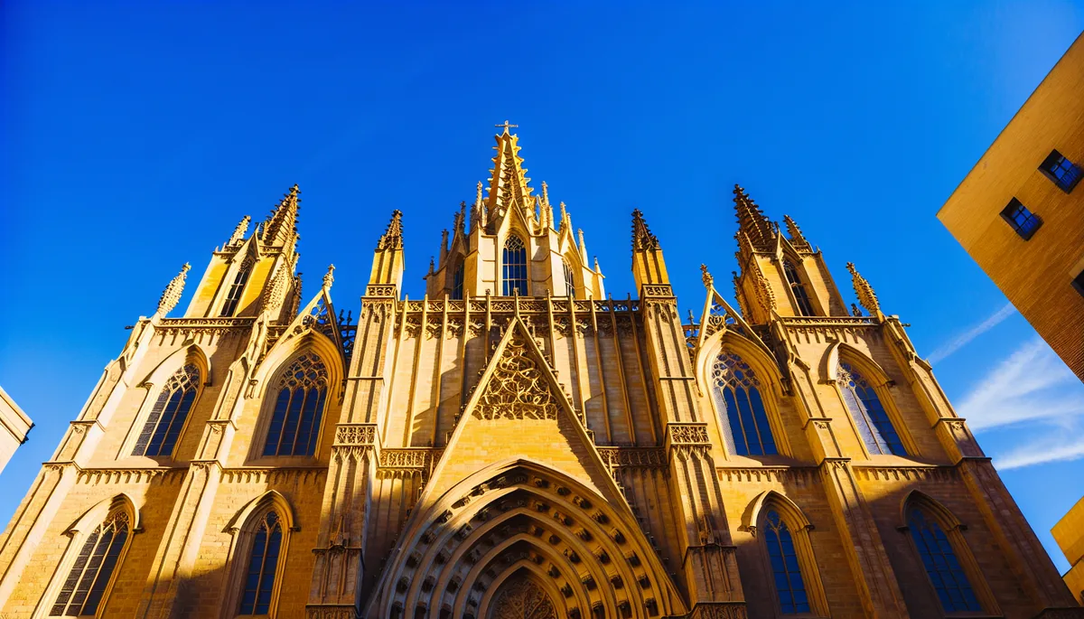 Beautiful architectural view of Barcelona's Sagrada Familia cathedral with blue sky and warm sunlight, representing European travel destinations