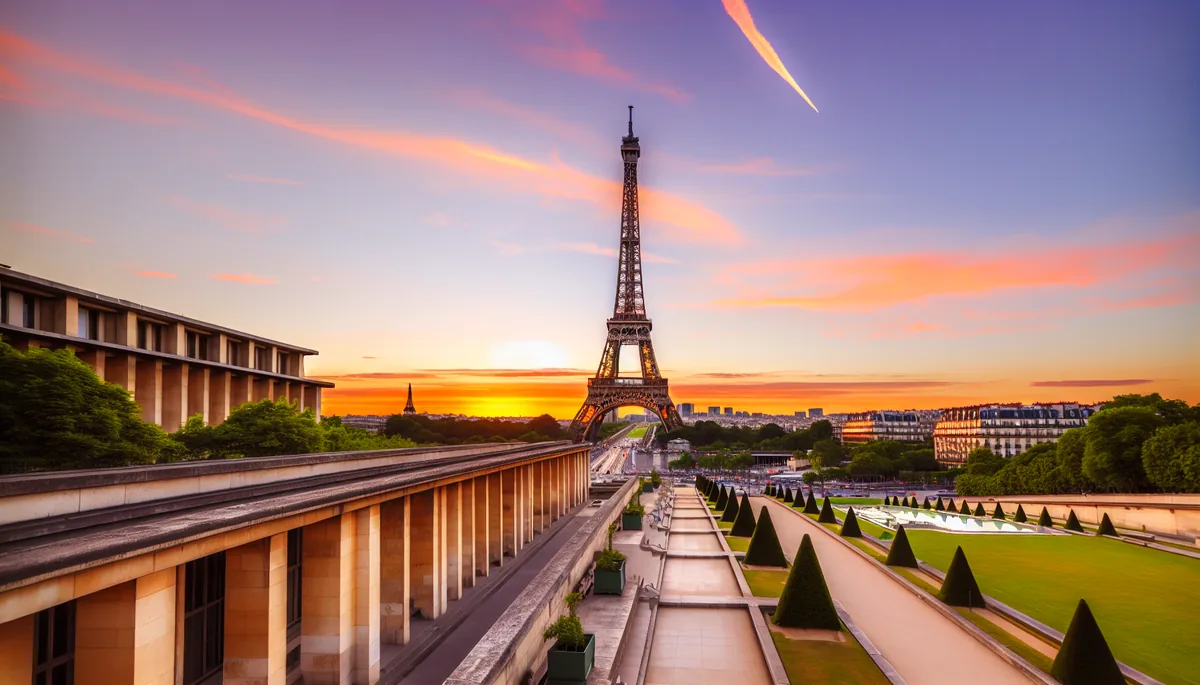 Golden hour view of the Eiffel Tower from Trocadéro gardens with classic Parisian architecture and warm sunset lighting