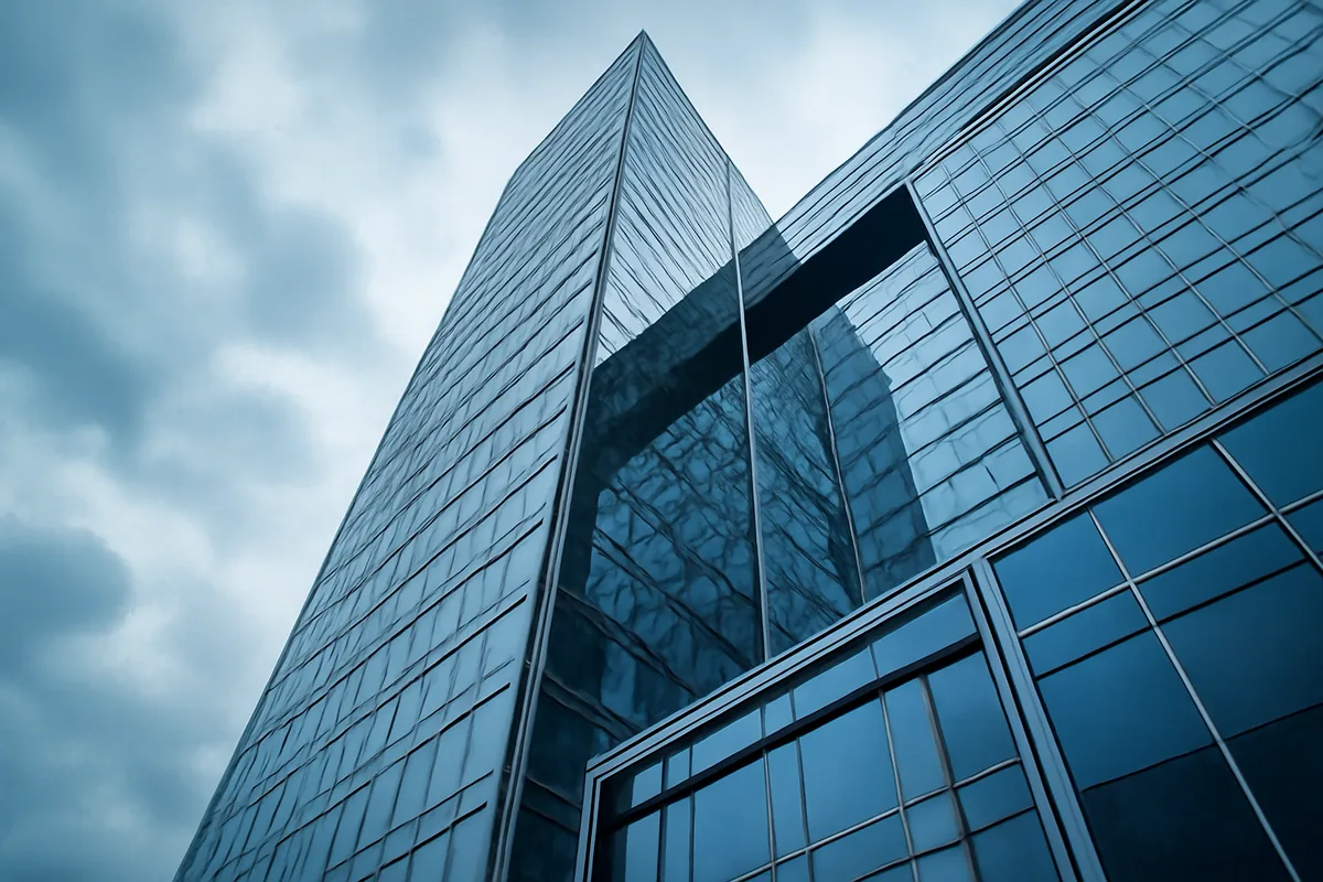 Modern glass skyscraper with geometric reflections in Moscow, representing digital innovation and connectivity