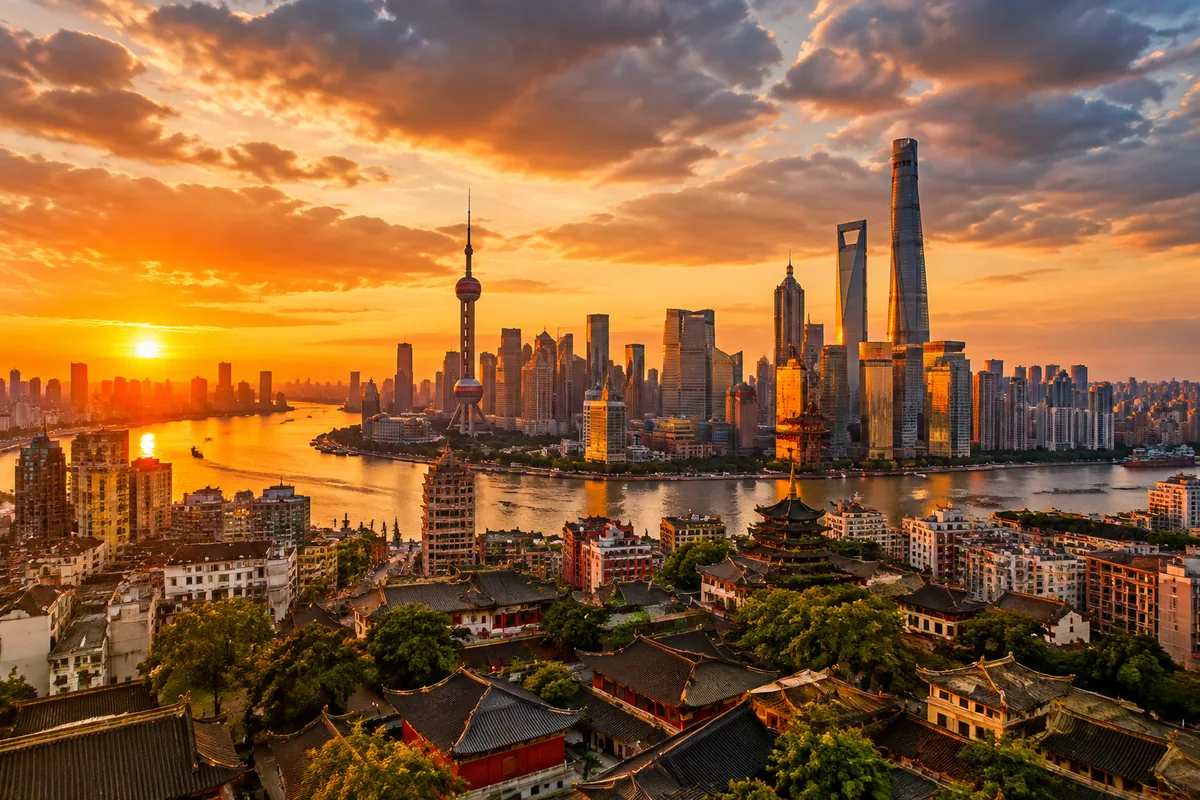 Aerial view of a vibrant Asian city skyline at golden hour, blending modern skyscrapers with traditional rooftops under a dramatic sunset sky